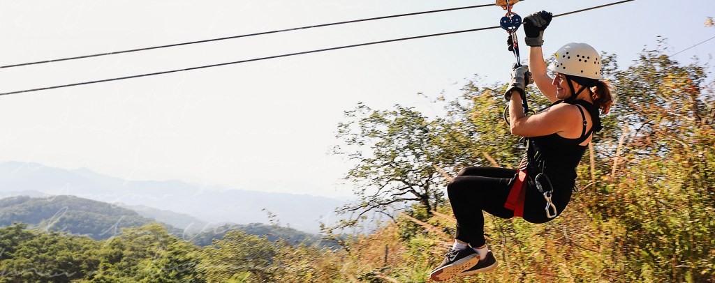 Woman zip lining 