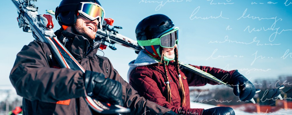 Couple walking with their skiis